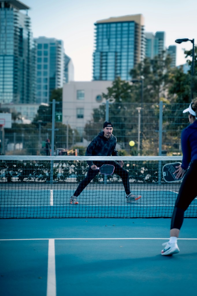 Two players exchanging a rally on an urban outdoor court